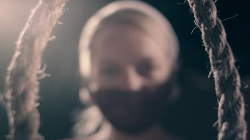Offred, sporting a red gag, readies herself for the hangman’s noose in a season two trailer.